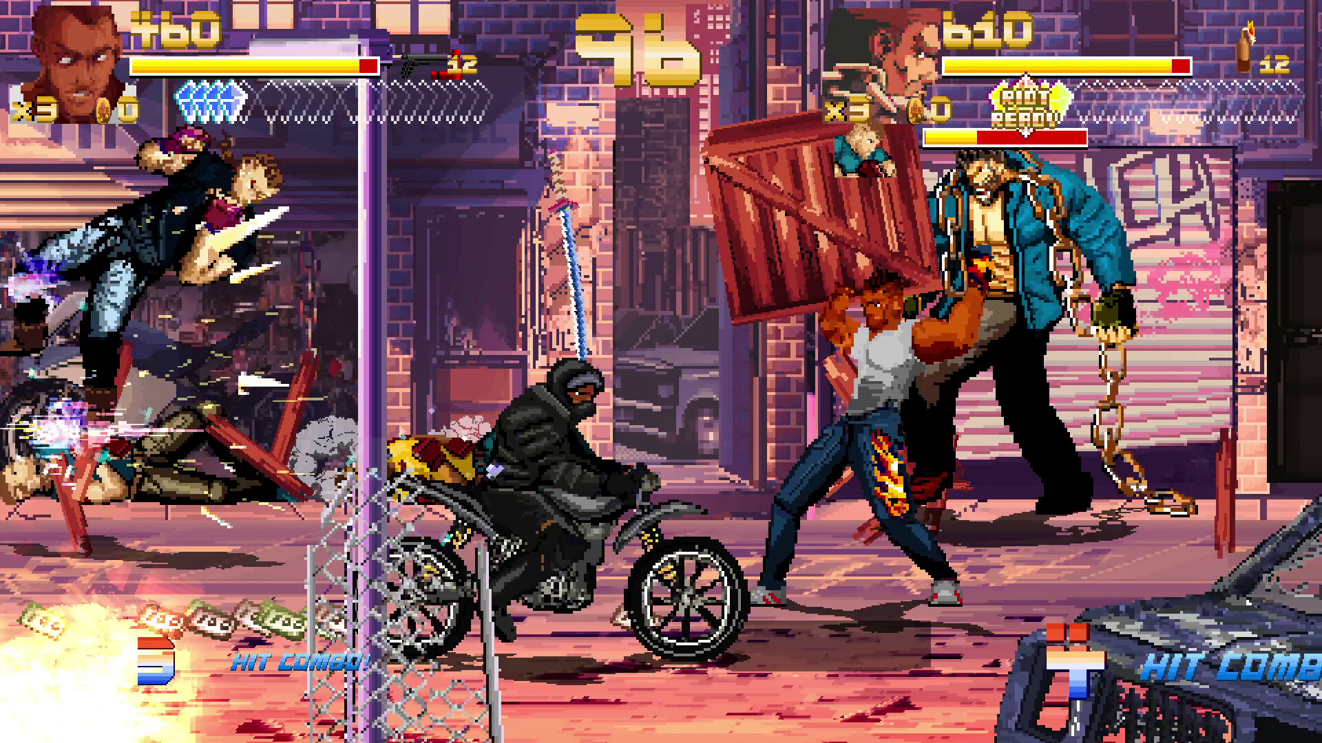 The image shows a pixel-art style street fighting video game scene set in an urban alley with brick walls and graffiti. On the left, a character is mid-air performing a flying kick, while an opponent lies on the ground amid broken wooden planks and action effects. In the center, a figure dressed in black and riding a motorcycle faces off against a muscular character holding a large wooden crate above his head, preparing to strike. Another large character stands behind, holding heavy chains, ready to engage. Health bars, combo indicators, and character portraits clutter the top of the screen, emphasizing the game's combat mechanics.