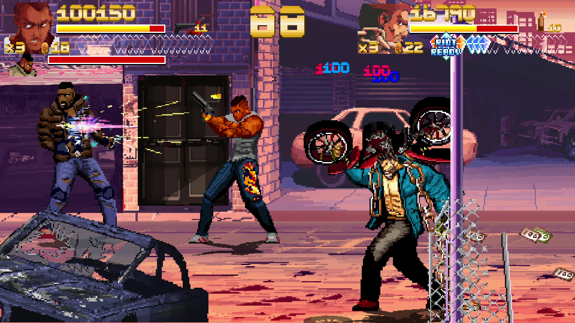 The image depicts a pixelated side-scrolling action video game scene featuring two muscular characters engaged in combat on a gritty urban street. One character on the left is shooting a weapon at an enemy, generating visible bullet trails and sparks, while the other character in the center-right holds a pistol pointed at an opponent. In the foreground, a figure is wielding a large car tire as a weapon, standing near a damaged fence and scattered money on the cracked pavement. The background shows rundown buildings and parked cars, contributing to a tense, street-fight atmosphere. Health bars, scores, and ammo counts are displayed at the top of the screen, indicating player status.