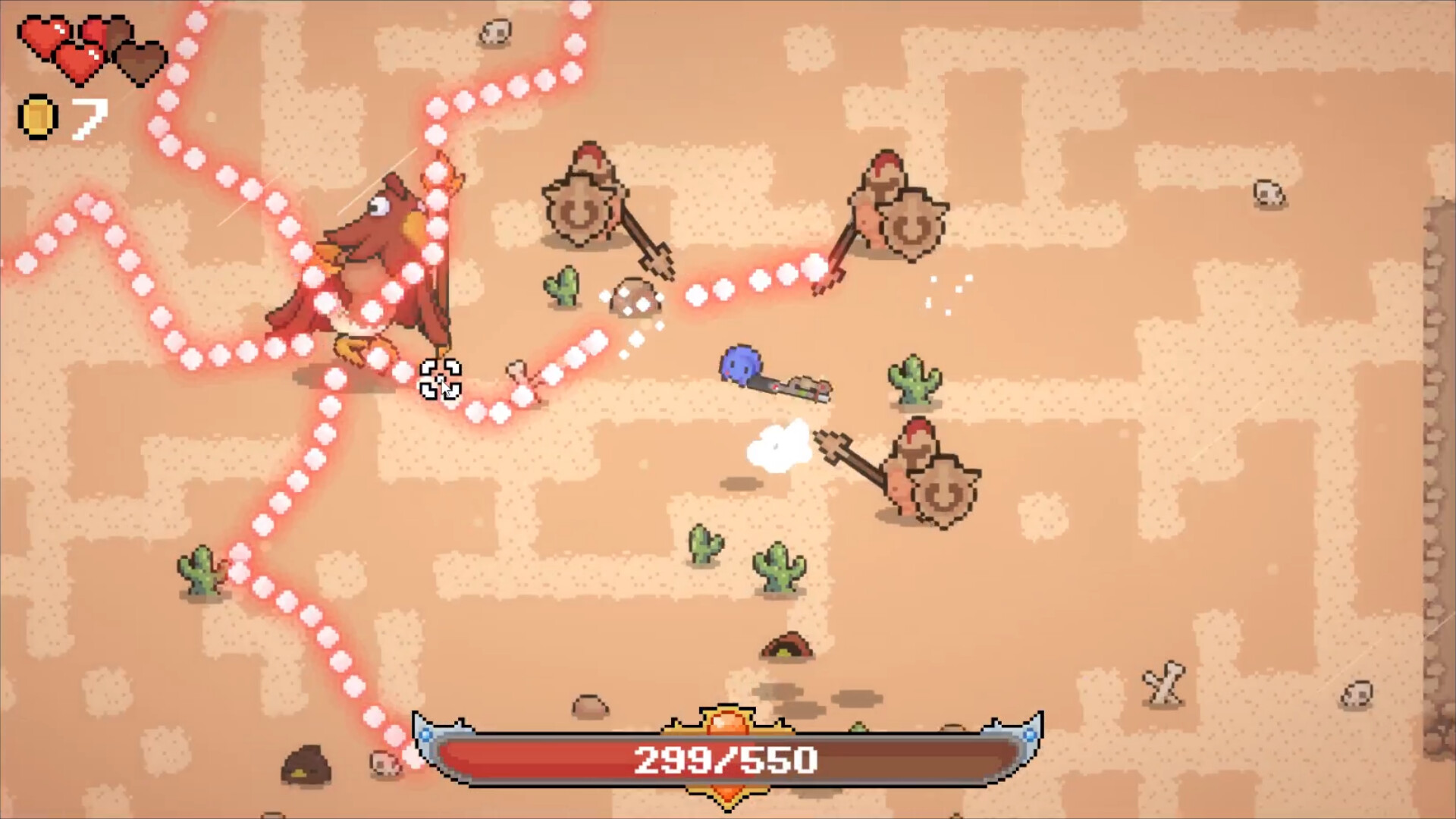 The image depicts a pixel-art style video game scene set in a desert environment with a sandy, beige background scattered with small cacti and skulls. A small blue player character is shooting a projectile at three brown, shield-wielding enemies positioned towards the right side of the screen, while a large red bird-like enemy on the left is being hit by multiple streams of pink glowing projectiles that branch out in different directions. In the top-left corner, the player’s status shows two full red hearts, one empty heart, and a count of seven gold coins. At the bottom center of the screen, a health bar partially depleted indicates the player has 299 out of 550 health points remaining.