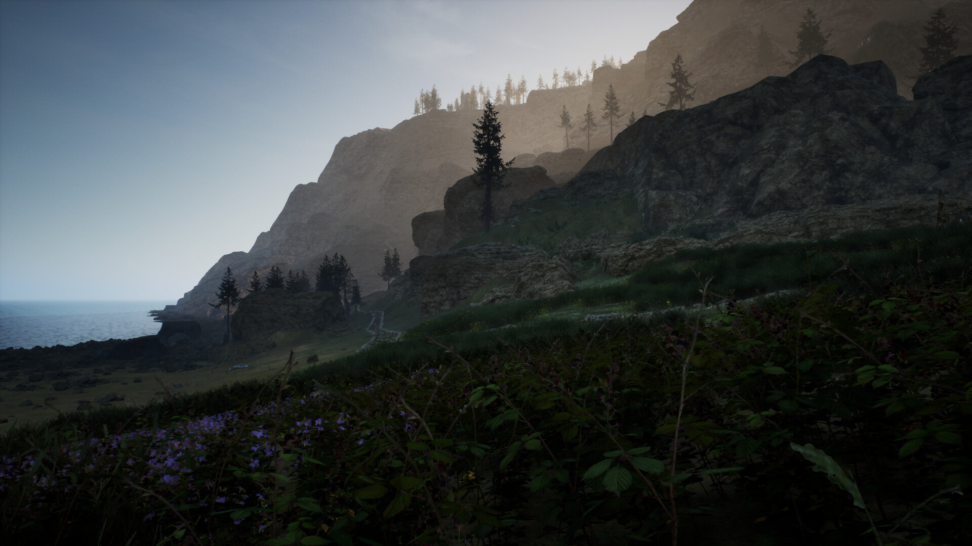 The image depicts a rugged coastal landscape with steep rocky cliffs rising from the shoreline. In the foreground, dense green vegetation and patches of purple wildflowers cover the ground, while the middle ground features a narrow winding path that leads toward the base of the cliffs. Tall pine trees are scattered across the slopes and atop the cliffs, which are bathed in soft, diffused light from an overcast sky, creating a serene and slightly misty atmosphere. The calm sea stretches out to the left, meeting the rocky coast at the horizon.