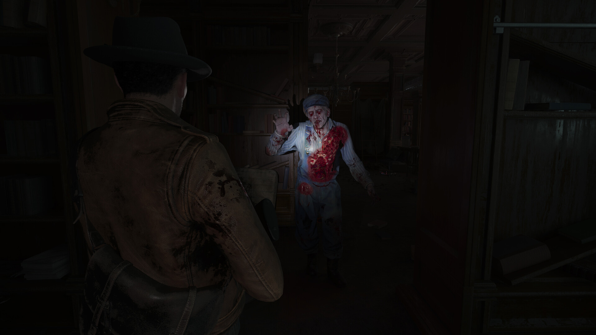 Library encounter: shambling infected worker with a gaping chest wound advances toward the hero’s flashlight beam.