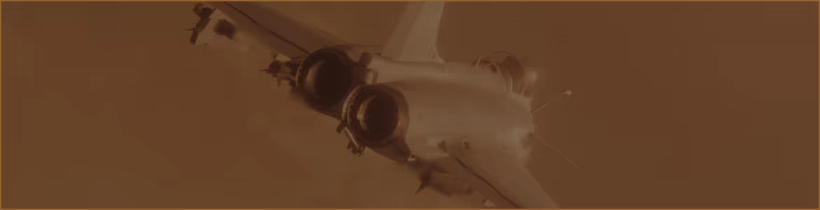 A fighter jet seen from above, flying through an orange sky