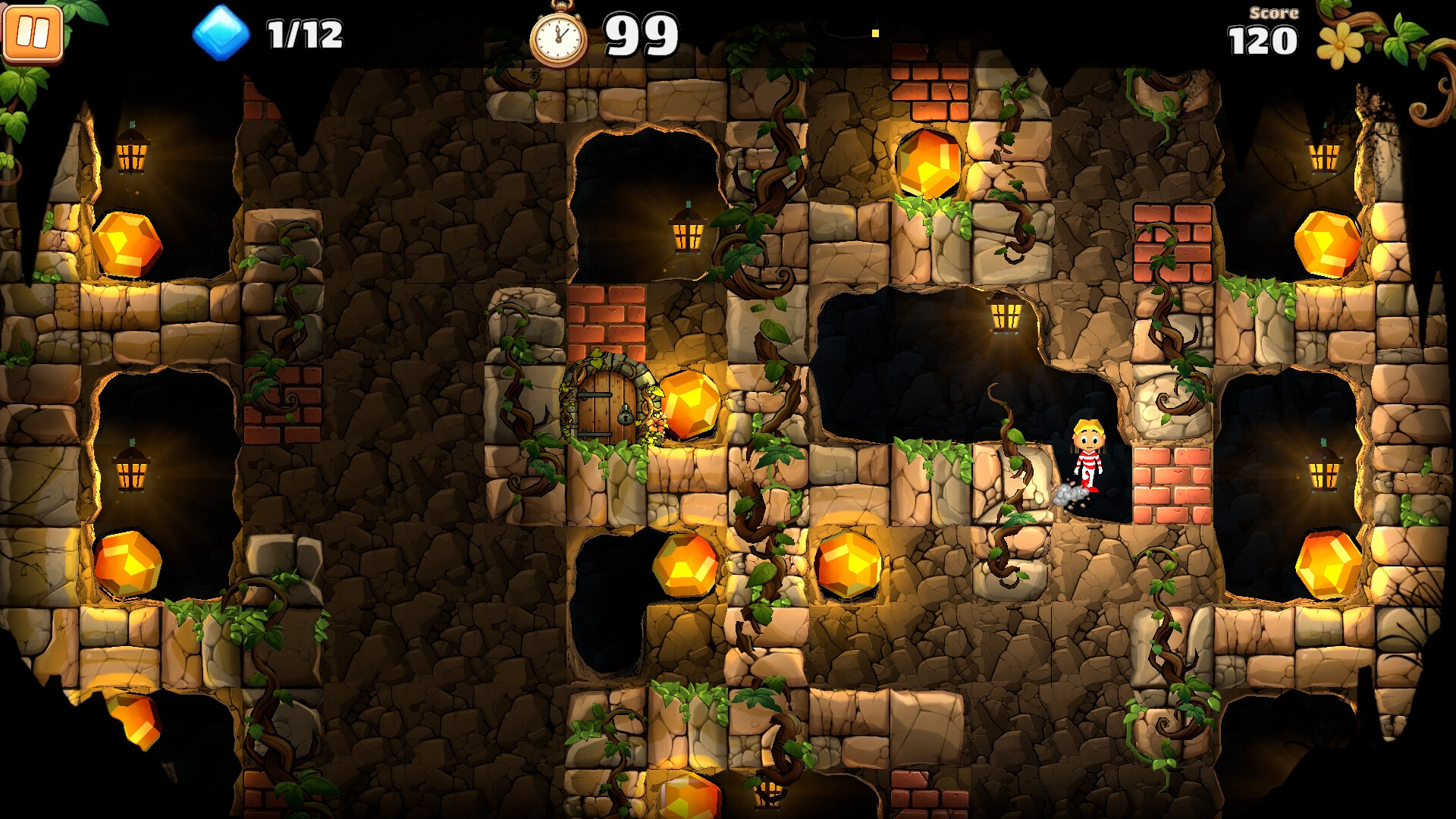 The image shows a colorful underground cave scene from a video game, with dirt and stone walls interspersed with vines and glowing orange gems embedded in recesses. A small cartoon character wearing a red and white outfit is standing on a ledge near the right side, surrounded by stone blocks and green vines. Several lanterns emit warm light, illuminating the recessed areas and a small wooden door covered with vines near the center-left of the scene. The top of the screen displays game information, including the number of collected gems (1 out of 12), a timer showing 99 seconds, and a score of 120.