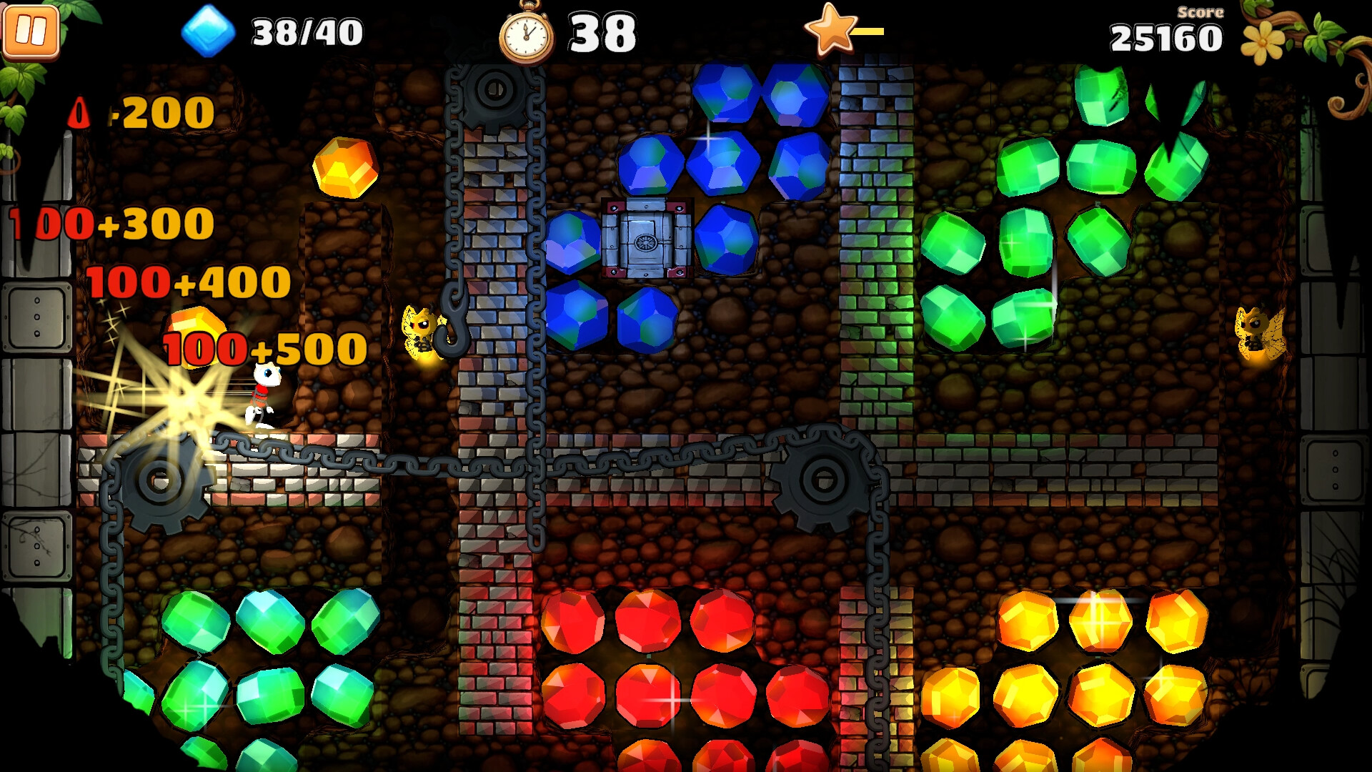 The image shows a colorful underground-themed level from a puzzle video game featuring a character navigating through a maze of stone walls and chains. The scene is filled with clusters of shiny, multi-colored gems in green, blue, red, and yellow, arranged in groups against a background of dark, rocky textures. The character, a small white figure, is positioned near a spinning gear mechanism, with bright numerical point values appearing nearby, indicating score increments. The game interface displays a blue gem collection count of 38 out of 40, a timer at 38 seconds, and a score of 25,160 in the corners of the screen.