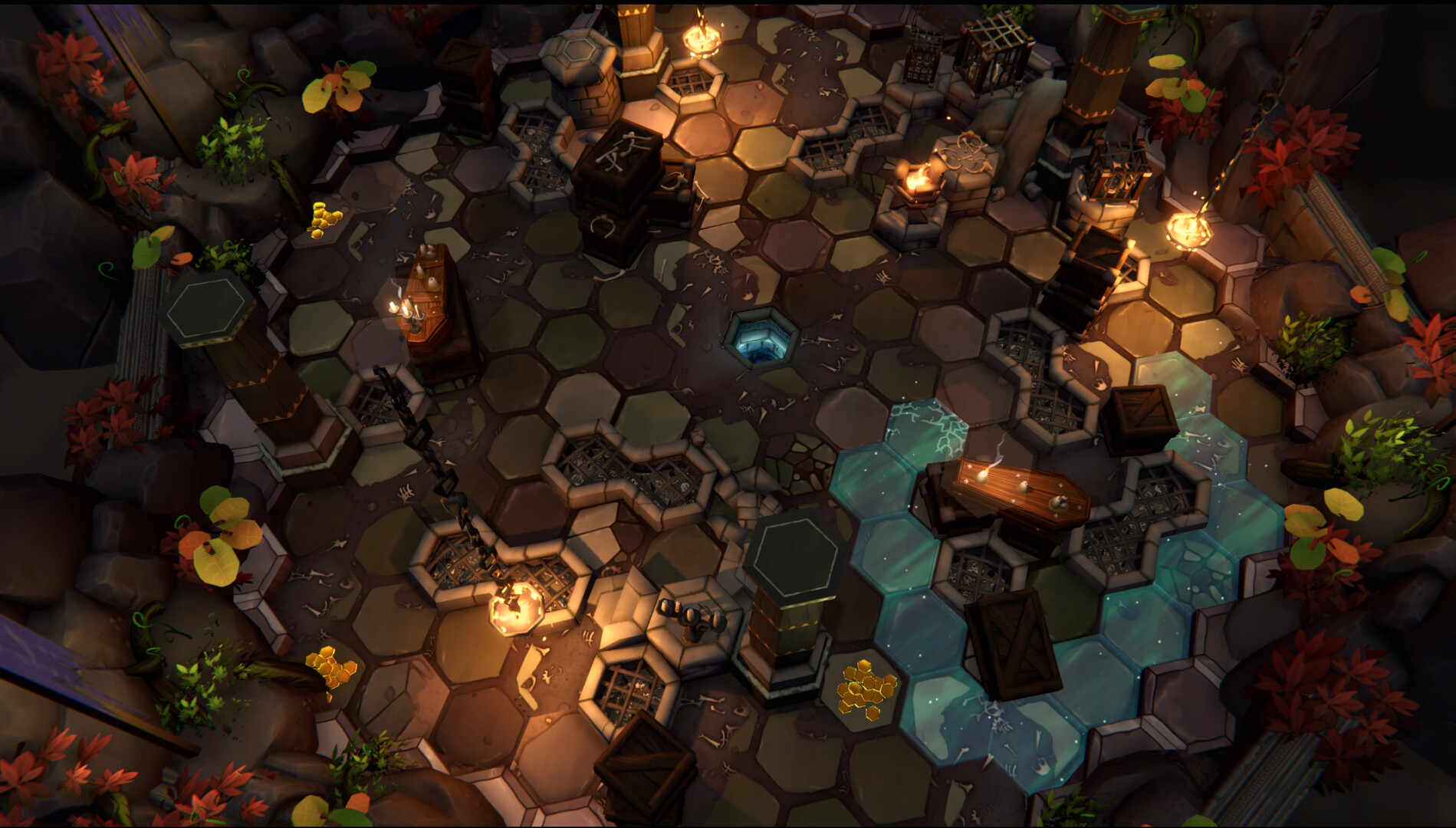 The image shows a top-down view of a hexagonal-tiled dungeon-like environment illuminated by warm torchlight. The floor consists of variously colored hexagonal tiles in shades of brown, green, and gray, some of which are cracked or feature grates and holes. Scattered throughout the scene are wooden crates, cages, and a table with candles, while pools of glowing blue liquid occupy some tiles near the bottom right. The surrounding walls are rocky and adorned with small plants and autumn-colored foliage, adding a natural, overgrown element to the otherwise man-made setting.