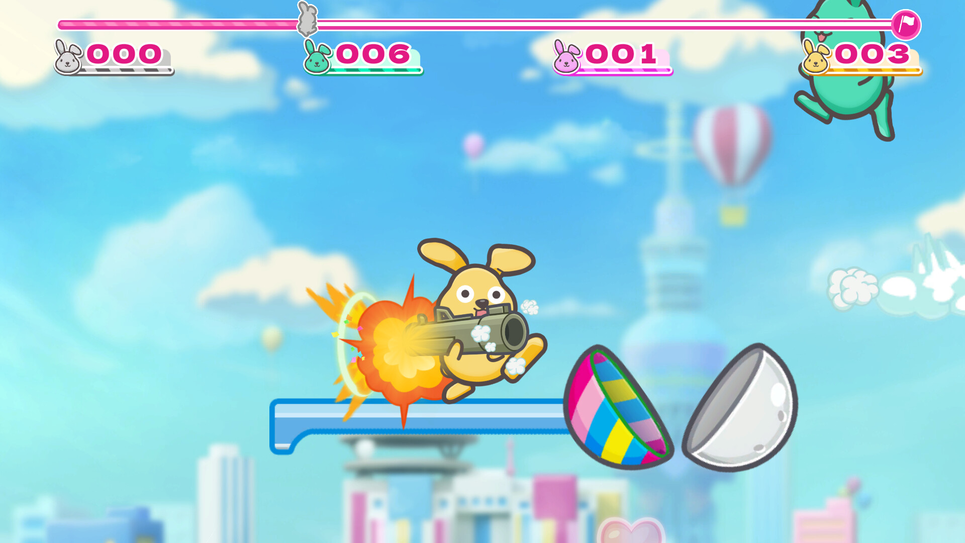 The image shows a colorful cartoon-style scene from a video game featuring a yellow bunny character holding and firing a large cannon, with flames and smoke coming out of the cannon's barrel. The bunny appears mid-jump on a blue platform against a bright sky with clouds and a hot air balloon in the background, along with a blurred cityscape below. At the top of the screen, there are four score indicators with different colored bunnies and numbers, suggesting a multiplayer game. Nearby, a colorful, striped shell-like object is split into two halves.