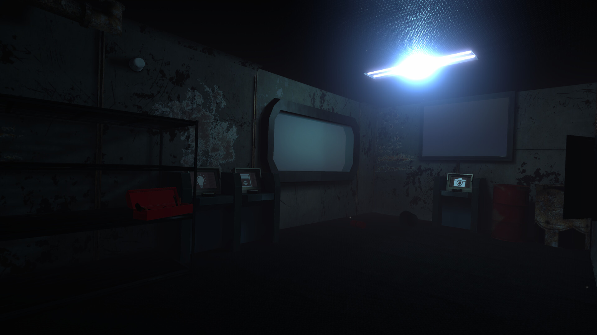 The image depicts a dimly lit, worn-down industrial-style room with peeling dark walls and a metallic floor. A bright, harsh fluorescent light on the ceiling casts a blue-white glow, illuminating various objects including a red toolbox on a metal shelving unit, several old, small computer terminals with screens displaying symbols, and a rusty red barrel near the back wall. The room has an unsettling, abandoned atmosphere, with visible signs of decay such as rust, grime, and chipped paint on the walls and objects.