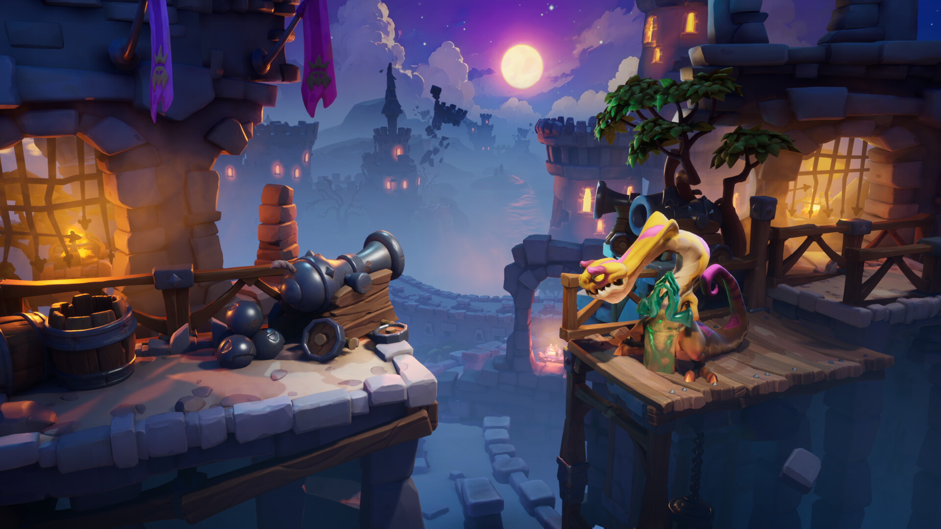 The image depicts a vibrant, fantasy-themed castle setting at night under a full moon, with a misty atmosphere and distant castle towers visible against a purple sky. In the foreground, two separate stone platforms are connected by a wooden bridge. On the left platform, there is an old cannon surrounded by cannonballs and wooden barrels, illuminated by a warm, glowing light from inside the castle. On the right platform, a colorful, cartoonish dragon-like creature with a long neck and bright pink and yellow markings stands near another cannon, next to a small leafy tree growing on the platform. The scene combines medieval architecture with a whimsical, animated style.