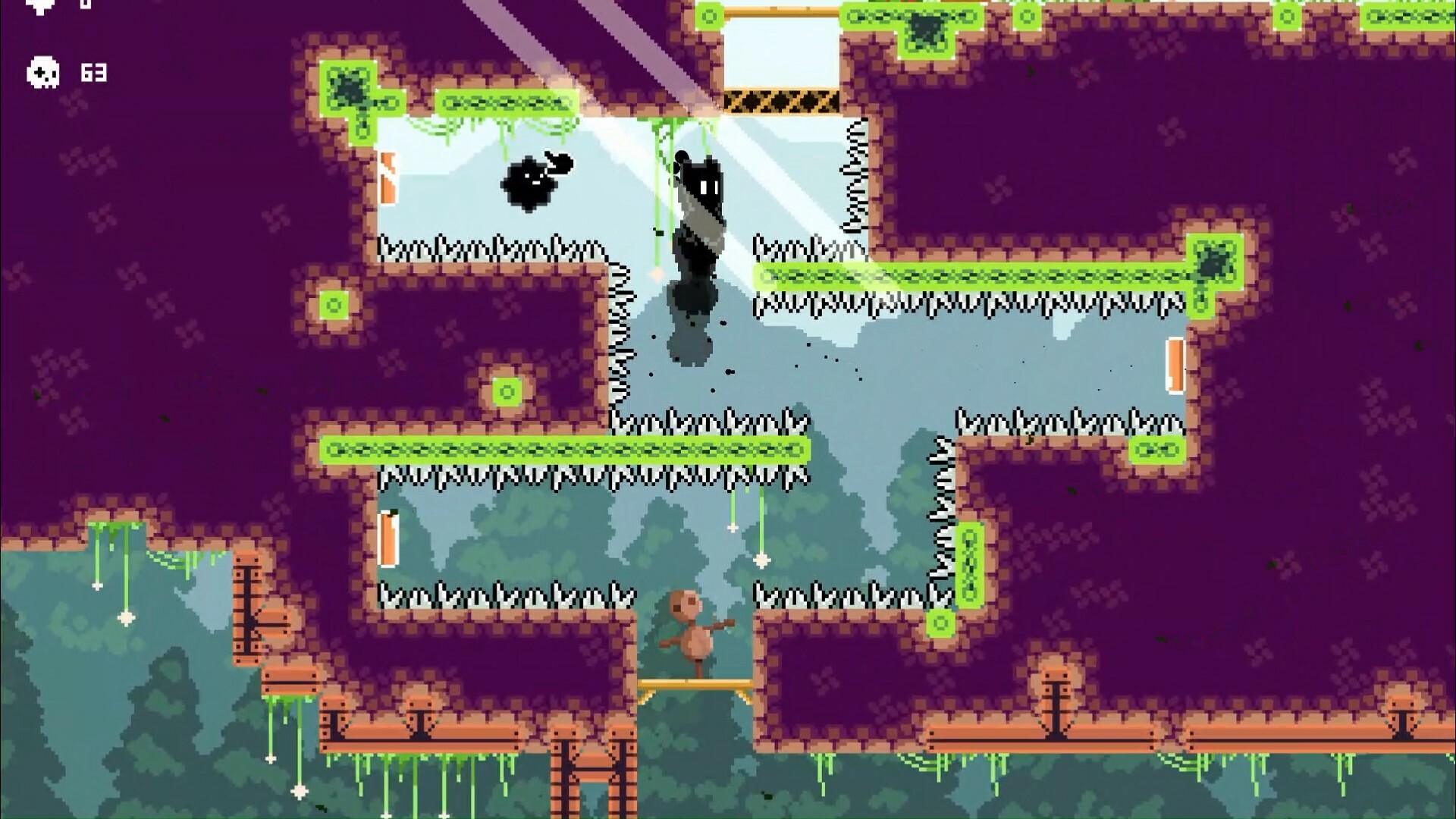 The image shows a pixel-art style platform video game scene set in a cavernous environment with purple and green terrain. A small brown character stands on a narrow wooden platform at the bottom-center, surrounded by spikes on nearly all sides, indicating a challenging obstacle course. Above the character, a black shadowy figure is hanging from a vine, with another small black floating creature nearby, both positioned above a pit filled with spikes, emphasizing the need for careful navigation. The background includes a silhouette of trees, adding depth to the scene.
