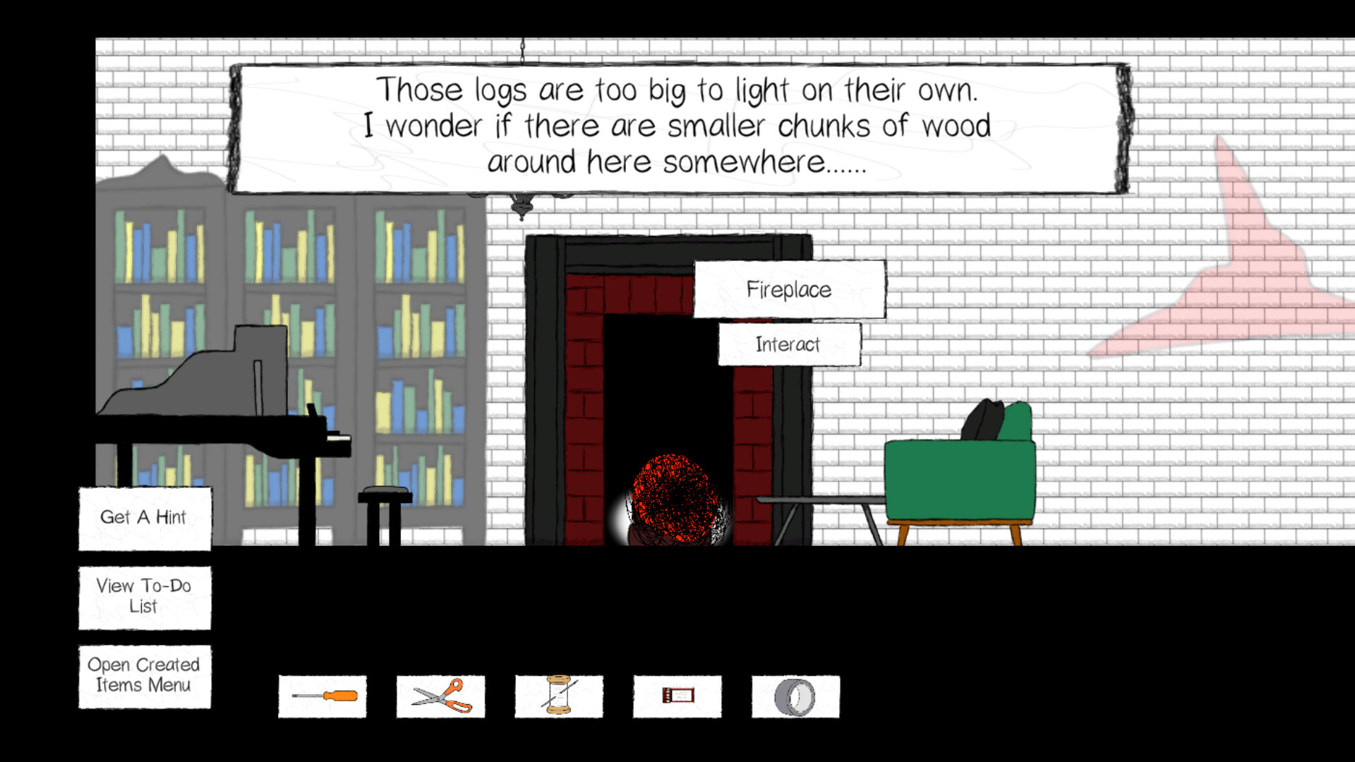 The image depicts a cozy room with a white brick wall background, featuring a fireplace in the center with a glowing red ember inside but no visible fire. Above the fireplace, a text box reads, "Those logs are too big to light on their own. I wonder if there are smaller chunks of wood around here somewhere......" To the left, there are two tall bookshelves filled with colorful books in blue, green, and yellow. In front of the bookshelves is a black piano and a small stool. To the right of the fireplace, there is a green armchair with a black cushion, positioned next to a small wooden coffee table. The bottom of the screen displays interactive buttons labeled "Get A Hint," "View To-Do List," and "Open Created Items Menu," along with icons of a screwdriver, scissors, spool of thread, a rectangular object resembling a ticket or card, and a metal ring. An interaction prompt labeled "Fireplace" with an "Interact" button is visible near the fireplace.
