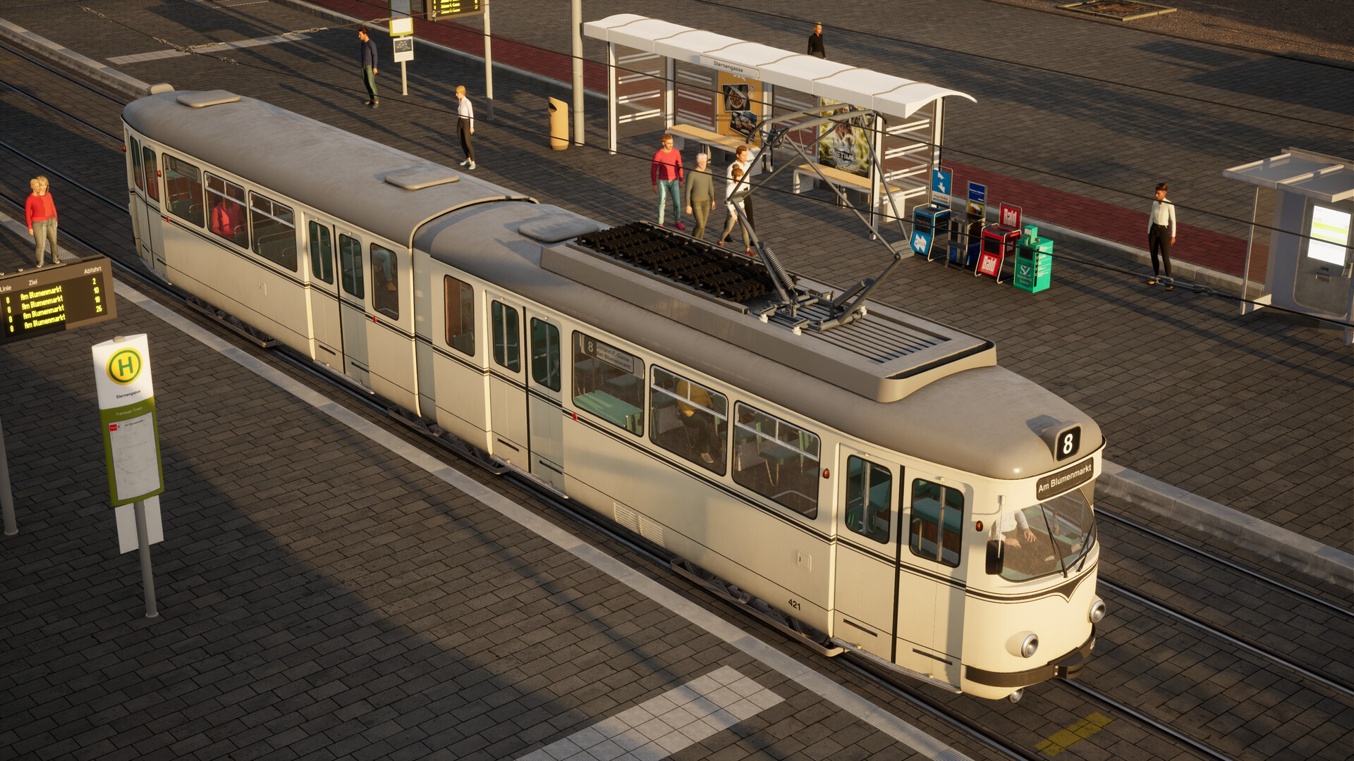 The image shows a cream-colored tram with the number 8 and the destination "Am Blumenmarkt" displayed at the front, stopped at a station named "Sternengasse." The tram has multiple windows through which a few passengers seated inside are visible, and an overhead pantograph connects it to the electric wires above. Surrounding the tram, several people are standing or walking along the paved platform, which features a sheltered waiting area with benches, a digital schedule display, and various newspaper vending machines. The scene is illuminated by warm sunlight, casting long shadows on the ground.
