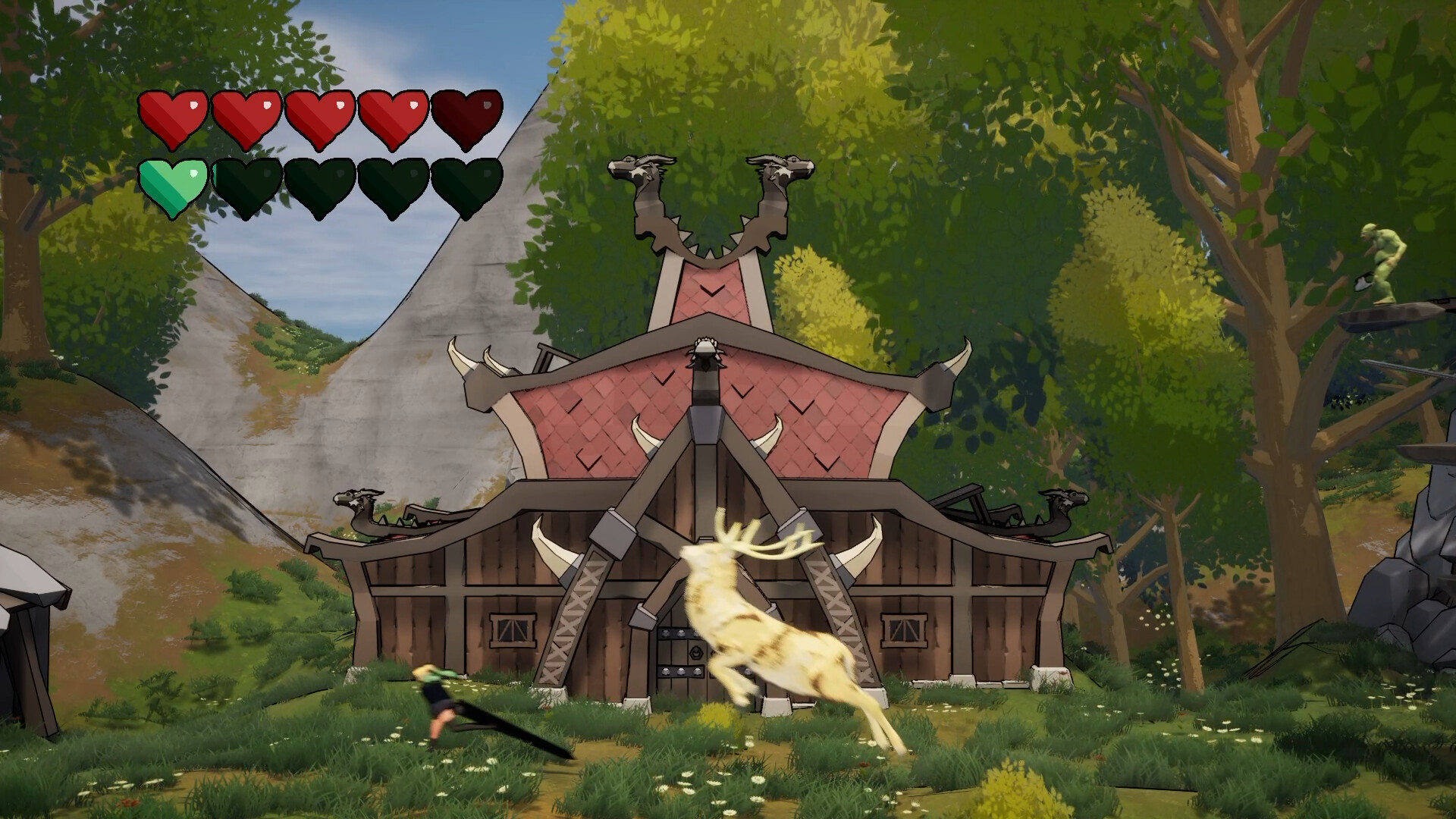 The image shows a fantasy-style wooden building with a red, multi-tiered roof adorned with horn and dragon head decorations, set against a backdrop of rocky hills and dense green trees. In front of the building, a glowing white stag is jumping, with a small blurred figure nearby suggesting motion or combat. In the top left corner, there are two rows of colored heart icons, likely representing a health or life indicator in a video game interface. The scene has a vibrant, animated style with lush grass and scattered flowers on the ground.