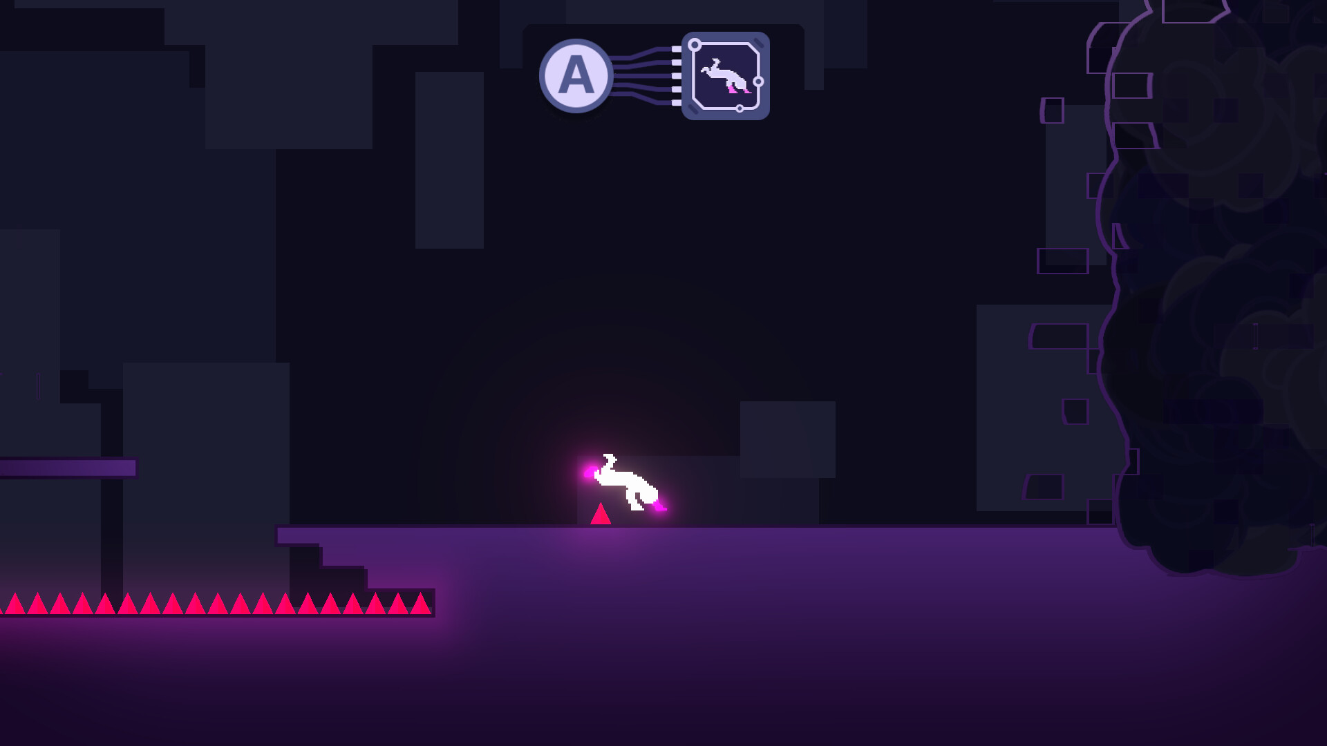 The image shows a dark, minimalist platformer game scene with a predominantly purple and black color scheme. In the center, a glowing white character with pink highlights is performing a mid-air flip or jump above a small red triangular object on a flat purple platform. To the left, there is a row of bright red, sharp spikes, indicating a hazard, and to the right, there is a large dark cloud of smoke or mist partially obscuring the background. Above the character, there is a small interface element with the letter 'A' connected by lines to a square icon depicting the character in a similar pose.