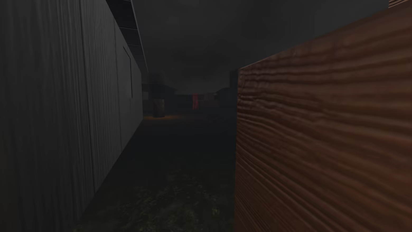 A red-robed cultist walks in the distance, while the player crouches next to a crate