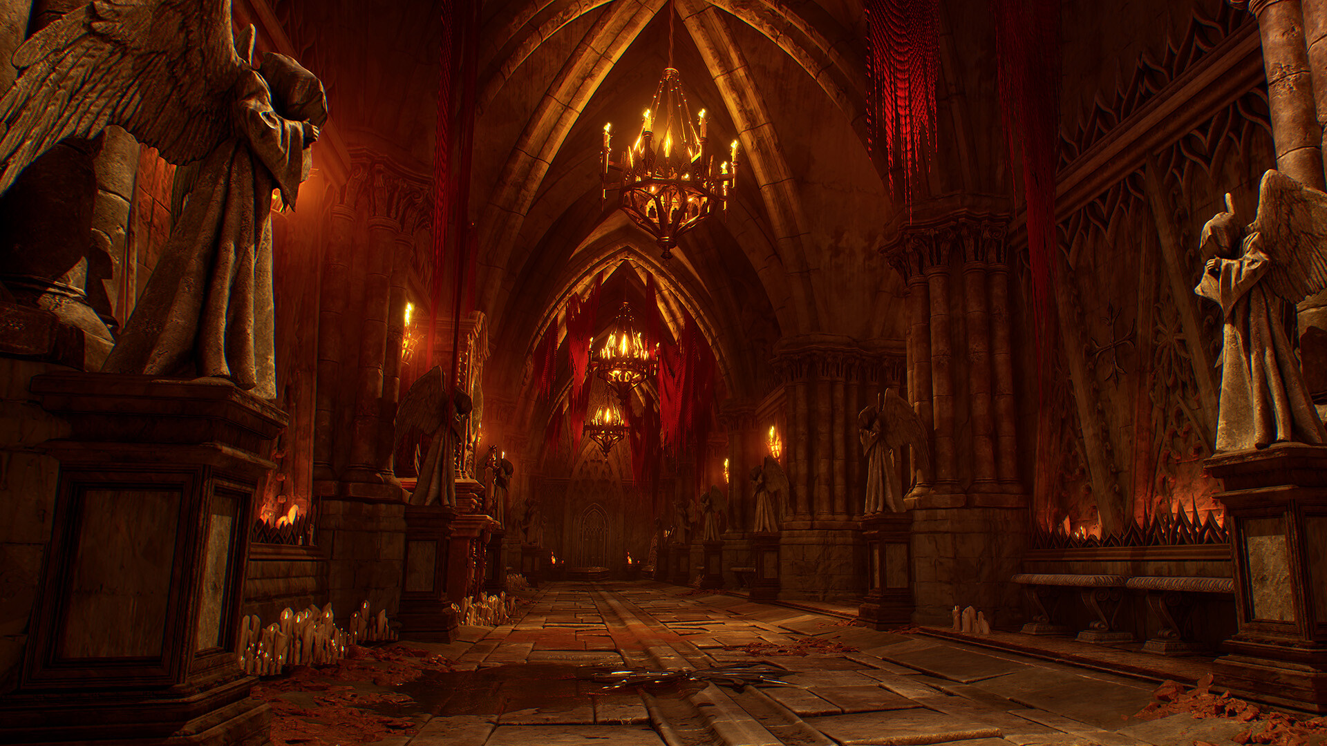 The interior of an ominous chamber rises to a point high above, with candled chandeliers casting a weak, atmospheric glow upon the long and narrow expanse. Statues of hooded angles flank the hall that extends into the distance.