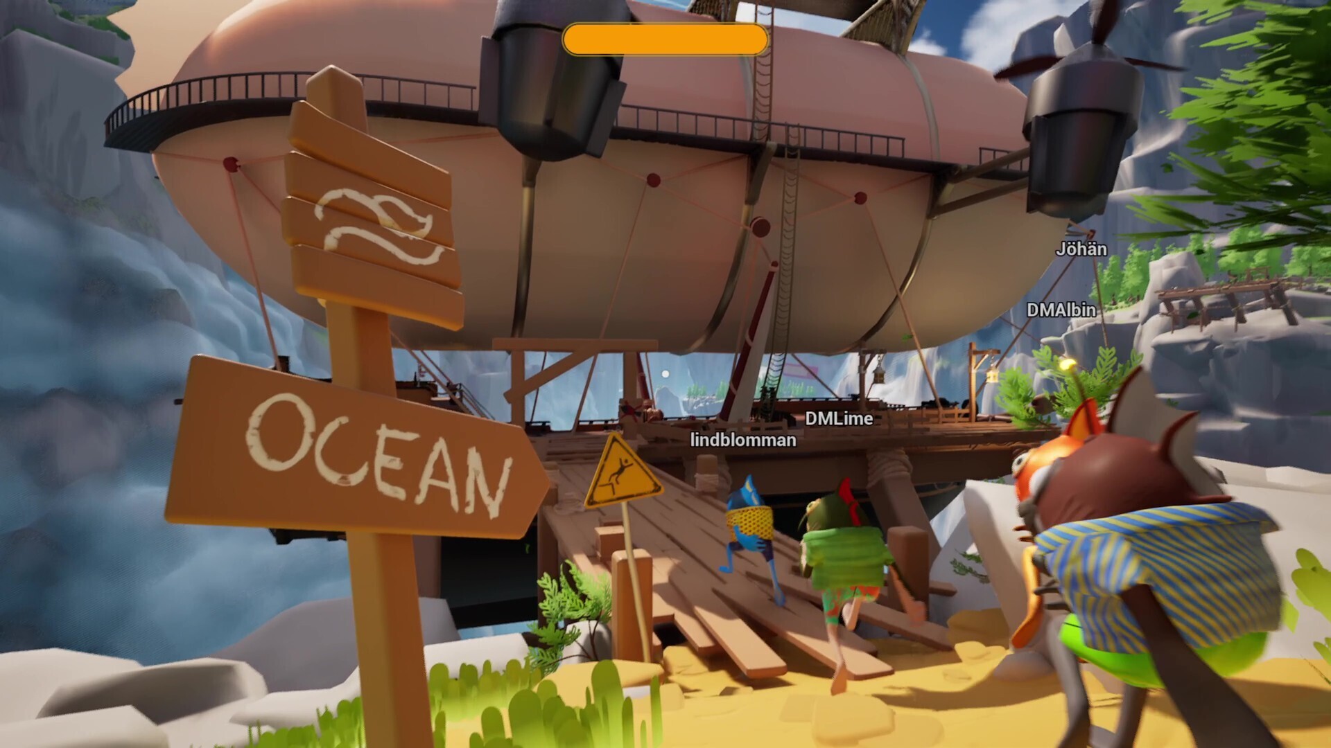 雪山の谷間に着陸したFish & Shipsの飛行船と、「OCEAN」と書かれた看板に向かって歩く複数の魚キャラクター